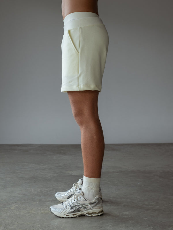 Vista lateral bermuda en algodón con bolsillos frontales