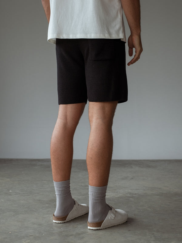 Bermuda tejida con bolsillo posterior.