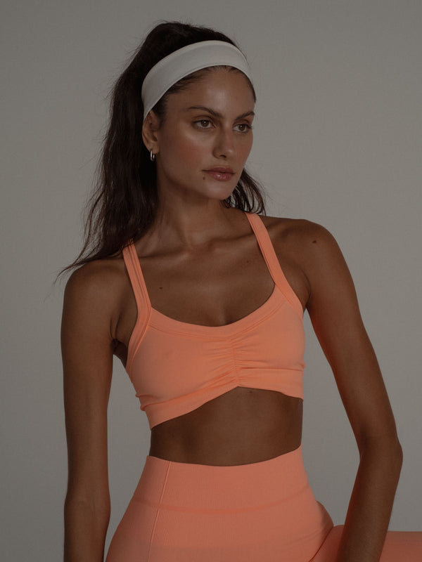 DRAPPED SEAMLESS CROP TOP APRICOT 24
